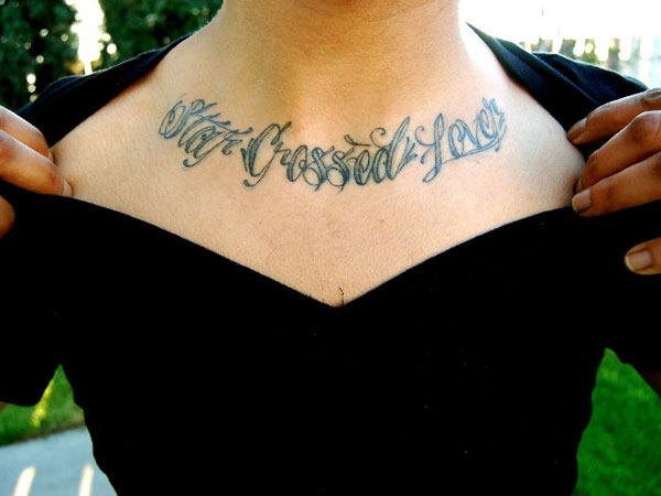 Divine feminine lettering tattoo hand poked on the